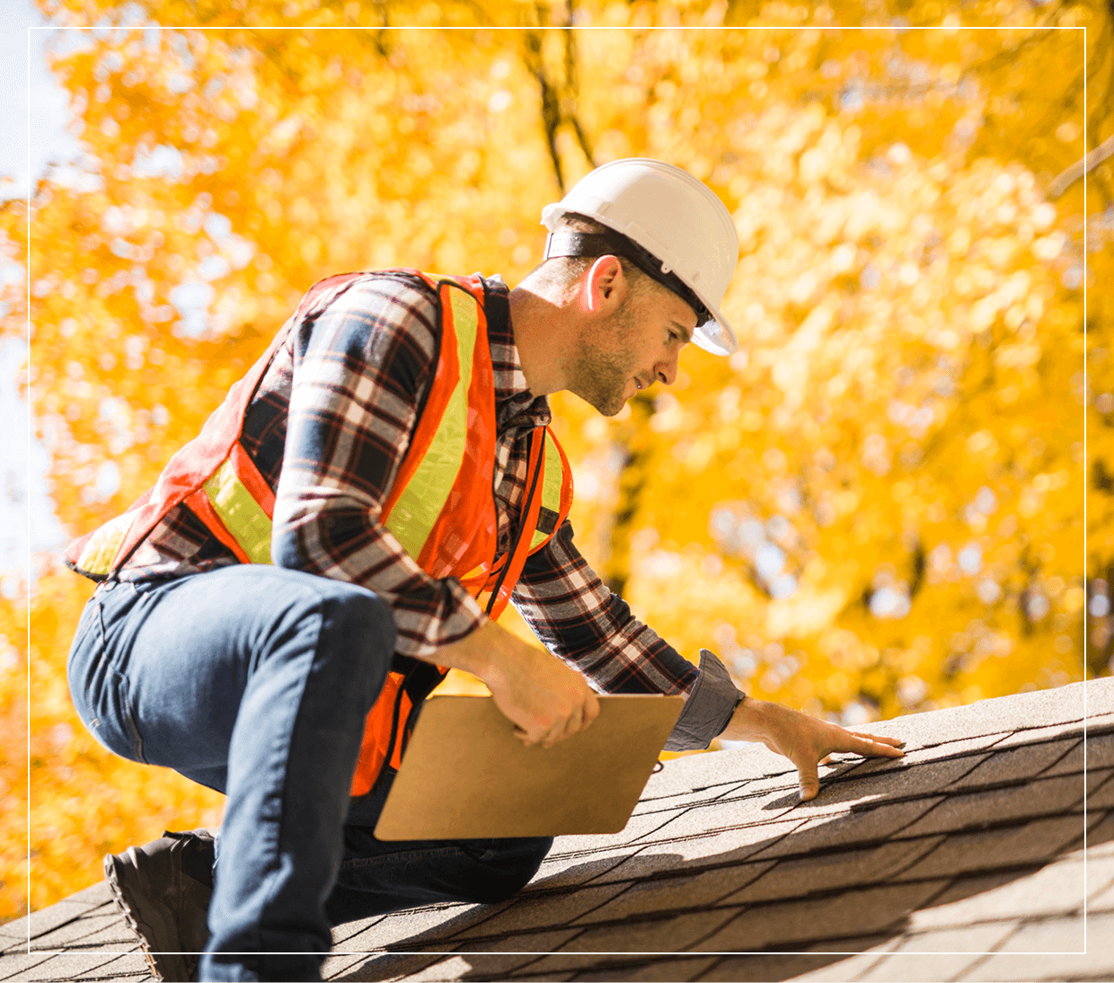 Roofer inspecting shingles on autumn day.